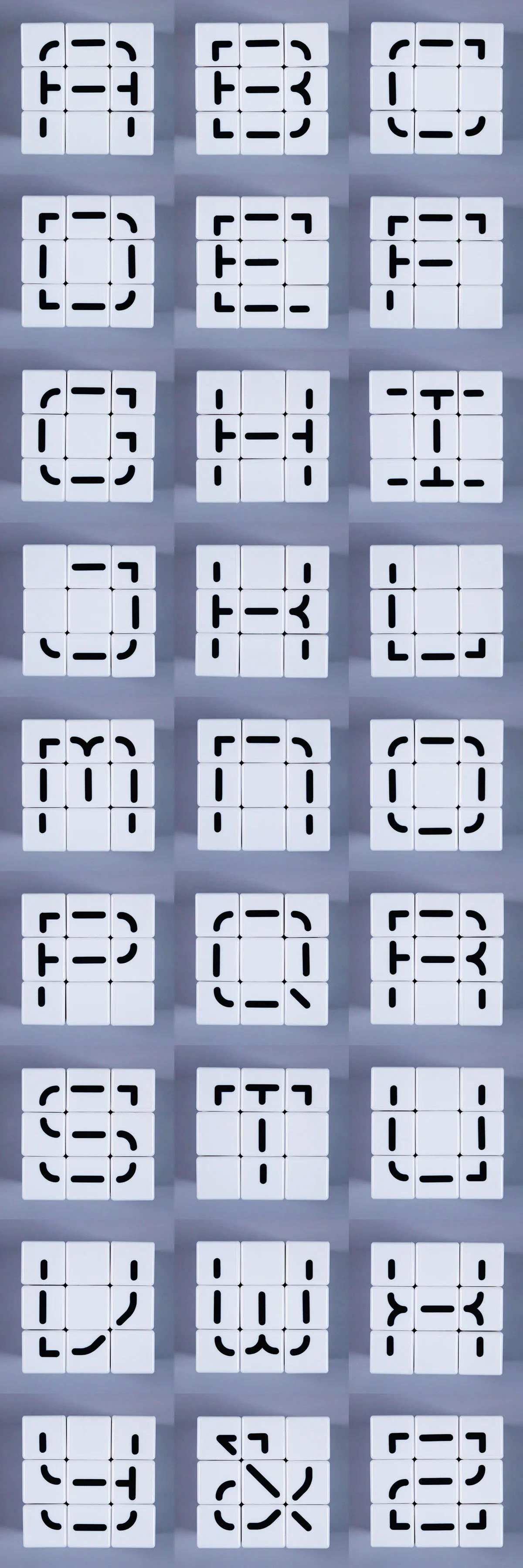 Grid of dozens of Erno Type cube faces, each arranged into a different custom letterform from the modular stroke system