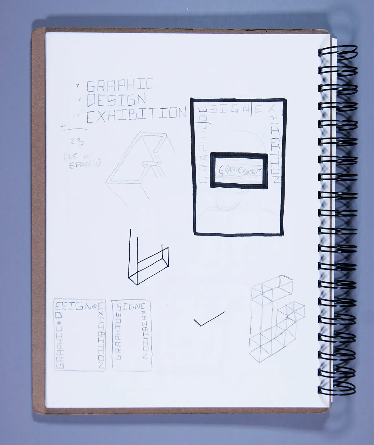 Sketchbook page of hand lettering studies and layout thumbnails for the ‘Graphic Design Exhibition’ and ‘Graphic Content’ poster